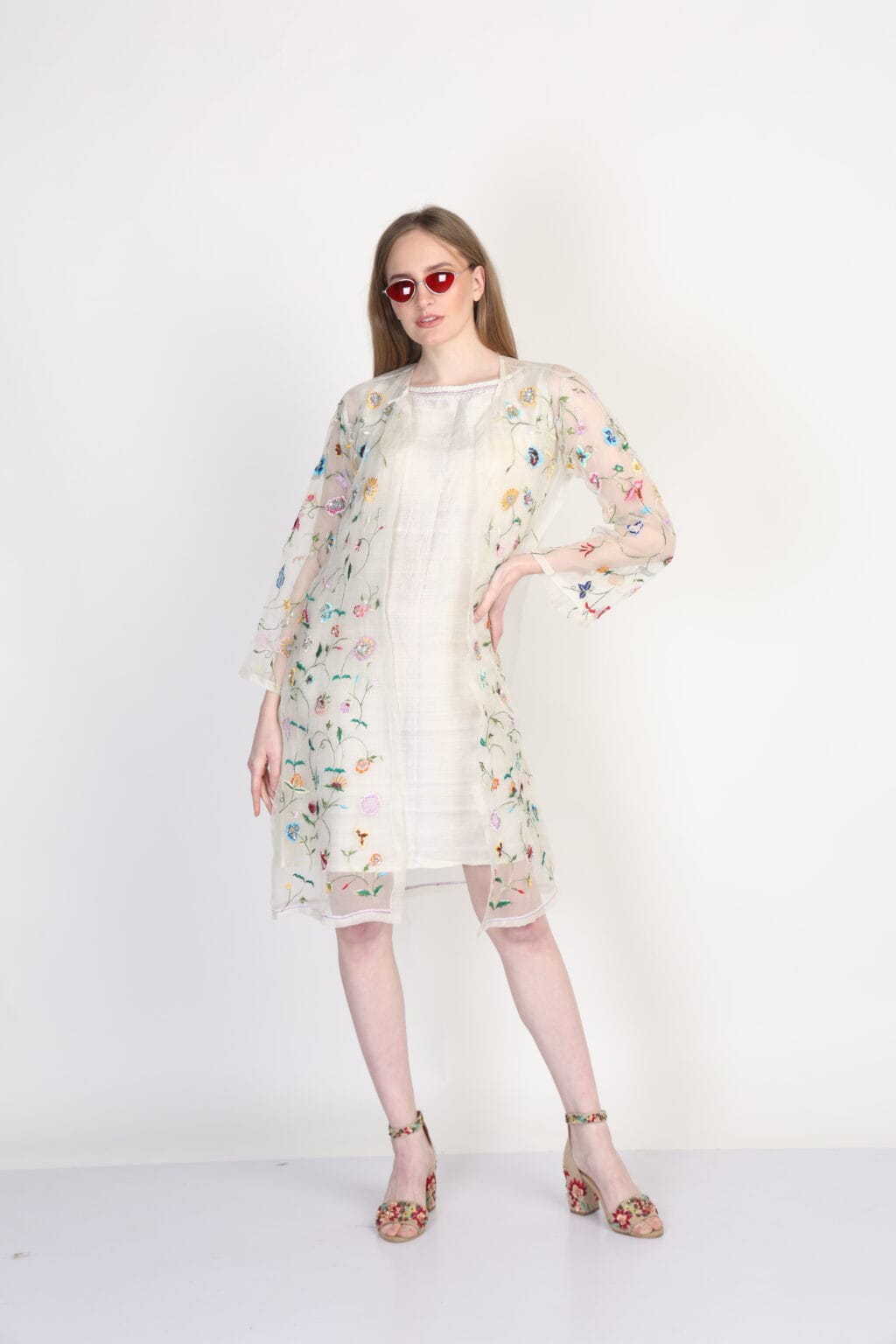 Exquisite hand-embroidered baagwan jacket with raw silk tunic featuring delicate craftsmanship and a graceful color gradient. Designed for elegance and style, perfect for festive occasions, weddings, and special events.