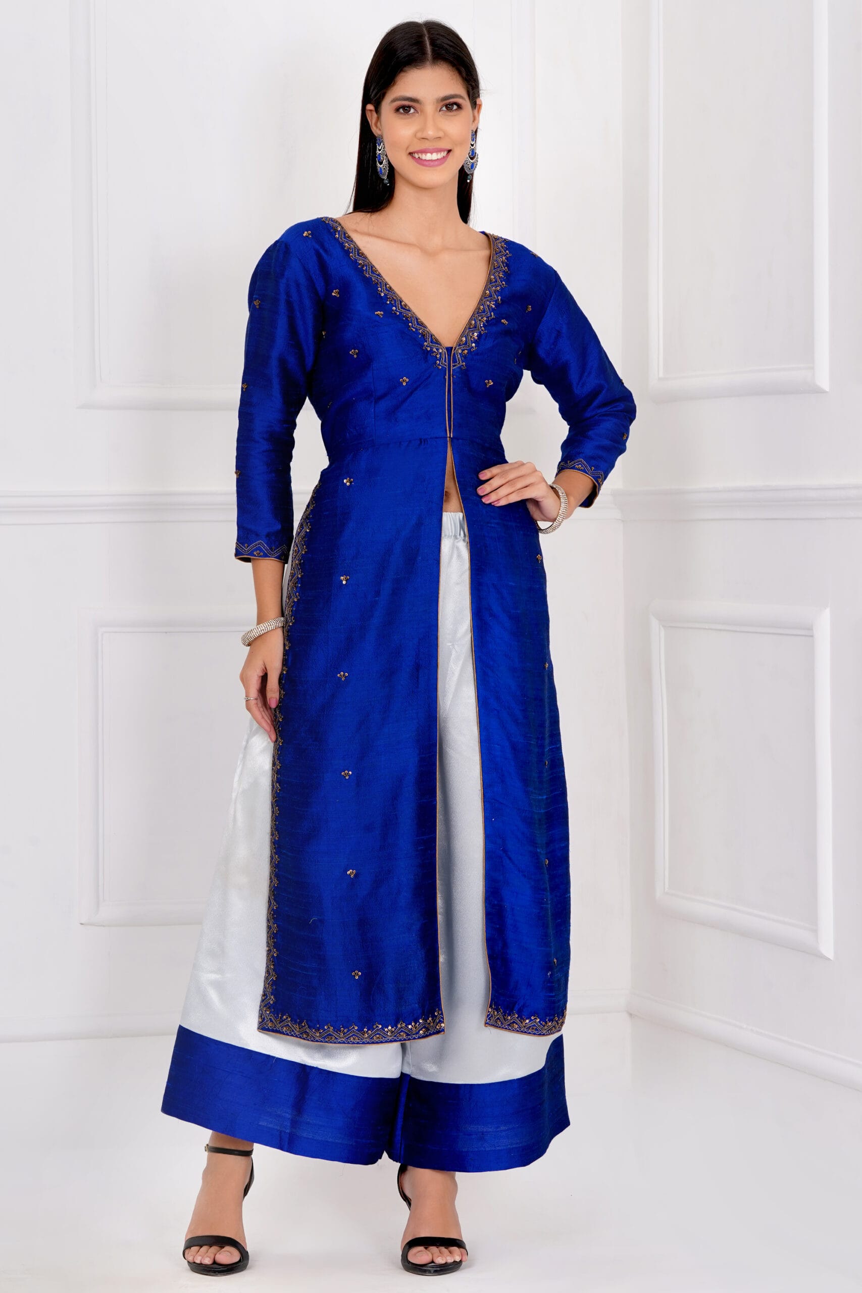 Elegant blue raw silk jacket with delicate embroidery paired with ice blue palazzo