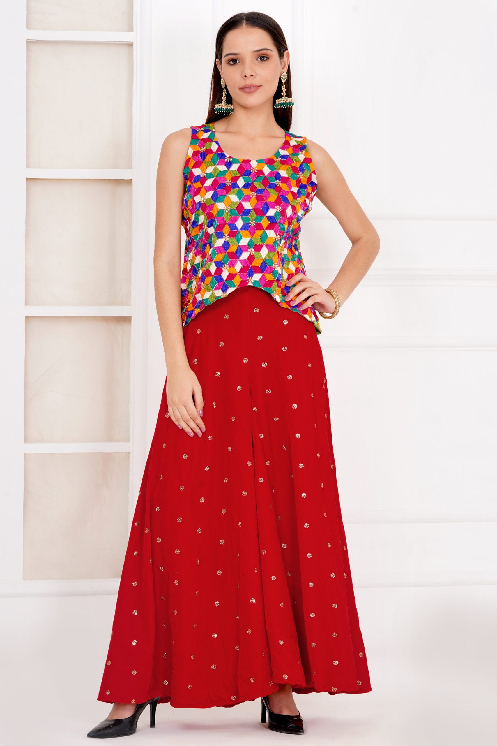 Exquisite hand-embroidered red velvet palazzo and top set, featuring delicate craftsmanship and a graceful color gradient. Designed for elegance and style, perfect for festive occasions, weddings, and special events