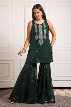 bottle green top and sharara set , a masterpiece adorned with intricate hand embroidery.