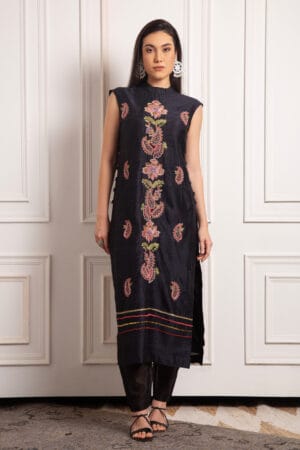 Black raw silk tunic and pants adorned with intricate gold zari, silk thread, cutdana , and moti embellishments.