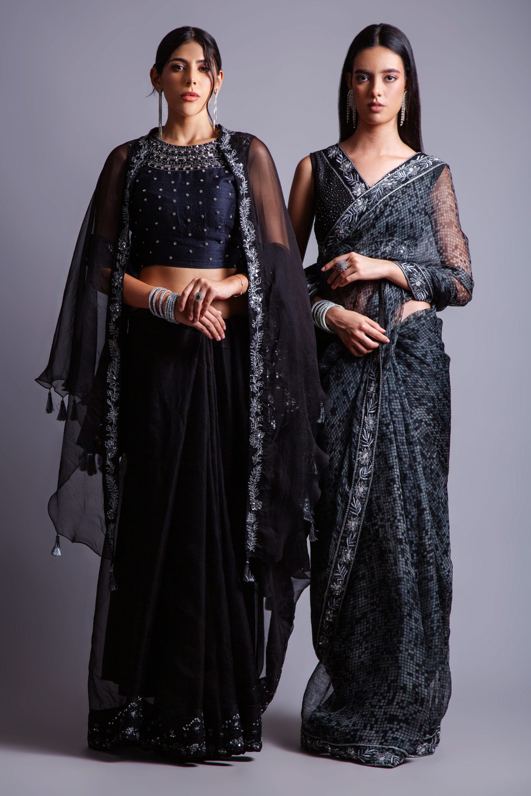 This exquisite embroidered Black Organza Sari is a masterpiece of craftsmanship, featuring silver zari, silk thread, cutdana, and stone detailing on a delicate Chanderi backing.