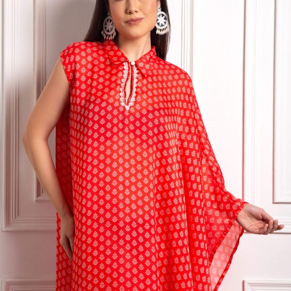 2N5A1340 Introducing the Red Flowy Kaftan, a harmonious blend of comfort and sophistication. Crafted from luxurious fabric, this kaftan drapes gracefully, offering a relaxed yet chic silhouette suitable for various occasions.